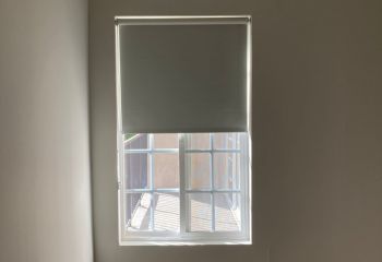 Precision-fitted custom window shades in bedroom ensure complete darkness and privacy for Palo Alto home