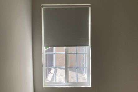 Precision-fitted custom window shades in bedroom ensure complete darkness and privacy for Palo Alto home